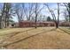 Charming single-story brick home featuring a well-maintained front yard and attached two-car garage at 8615 El Rico Dr, Indianapolis, IN 46240