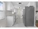 Updated kitchen featuring white cabinetry, stainless steel appliances, and granite countertops at 8615 El Rico Dr, Indianapolis, IN 46240