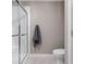 Clean and modern bathroom features a glass-enclosed shower and white fixtures, creating a refreshing and functional space at 8810 E 200 S, Zionsville, IN 46077