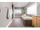 Bathroom featuring a large soaking tub, tiled floors, granite countertops and walk-in shower at 8810 E 200 S, Zionsville, IN 46077