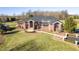 A beautifully landscaped property featuring a brick home with a winding driveway at 8810 E 200 S, Zionsville, IN 46077