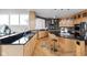 Modern kitchen with stainless steel appliances, granite countertops, and hardwood floors at 8810 E 200 S, Zionsville, IN 46077