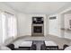 Inviting living room with fireplace, TV, large window, and a bar area at 8810 E 200 S, Zionsville, IN 46077