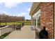 Wide patio featuring a brown grill and large sliding glass doors, providing a seamless indoor-outdoor living experience at 8810 E 200 S, Zionsville, IN 46077