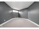 A room with gray walls, carpeted flooring, and a window at 8810 E 200 S, Zionsville, IN 46077