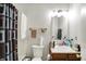 This full bathroom has a shower and tub, a toilet, a mirror and a sink at 10270 Yosemite Ln, Indianapolis, IN 46234