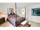 Bedroom with a four-poster bed, bedside table, and decor at 10270 Yosemite Ln, Indianapolis, IN 46234