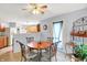 Cozy dining area with wooden table, metal chairs, and view to the kitchen at 10270 Yosemite Ln, Indianapolis, IN 46234