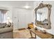 Welcoming entryway with a decorative mirror, stylish furnishings, and neutral tones, creating a sophisticated ambiance at 10270 Yosemite Ln, Indianapolis, IN 46234