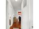 Bright hallway with wood floors, neutral walls, and access to the main living spaces of the home at 10270 Yosemite Ln, Indianapolis, IN 46234