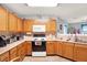 Functional kitchen with wood cabinets and modern appliances at 10270 Yosemite Ln, Indianapolis, IN 46234