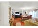 Inviting open-concept featuring a dining area with hardwood floors, blending seamlessly with a comfortable living space at 10270 Yosemite Ln, Indianapolis, IN 46234