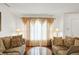 Cozy living room with natural light and stylish furnishings creating a welcoming and comfortable atmosphere at 10270 Yosemite Ln, Indianapolis, IN 46234