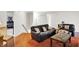 Comfortable living room with wood floors, neutral walls, and stylish furnishings creating a welcoming atmosphere at 10270 Yosemite Ln, Indianapolis, IN 46234