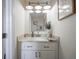 Bathroom with white vanity, granite countertop, and stylish faucet at 10920 Gate Cir, Fishers, IN 46038