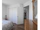 Bedroom with closet, wood-look floors, and great natural light at 10920 Gate Cir, Fishers, IN 46038