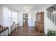 Dining area featuring a view into the kitchen, a staircase, and traditional furnishings at 10920 Gate Cir, Fishers, IN 46038
