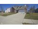 Attractive single-Gathering home featuring a brick facade, dormer windows, and a two-car garage at 10920 Gate Cir, Fishers, IN 46038