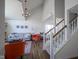 Bright living space featuring a vaulted ceiling, staircase, and stylish furniture at 10920 Gate Cir, Fishers, IN 46038