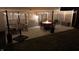 Patio with outdoor lighting highlighting the seating area, table with firepit, and umbrella at 10920 Gate Cir, Fishers, IN 46038