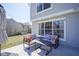 A patio with outdoor furniture including a seating area with a couch and pillows at 10920 Gate Cir, Fishers, IN 46038