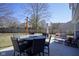 Exterior shot of a patio area featuring outdoor furniture, including chairs, table, and couch at 10920 Gate Cir, Fishers, IN 46038