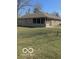 Brick home with a screened in porch and spacious backyard at 1103 Charleston Commons Dr, Anderson, IN 46012