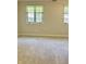 Bright bedroom featuring neutral paint, plush carpet and windows with blinds at 1103 Charleston Commons Dr, Anderson, IN 46012