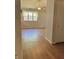 Bedroom with hardwood flooring and a window overlooking the backyard at 1103 Charleston Commons Dr, Anderson, IN 46012