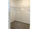 Walk-in closet featuring carpeted floors and white wire shelving at 1103 Charleston Commons Dr, Anderson, IN 46012