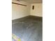 Spacious garage with concrete flooring, white walls, and an electrical panel at 1103 Charleston Commons Dr, Anderson, IN 46012