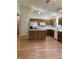 Bright kitchen with a center island, white countertops and wooden cabinets at 1103 Charleston Commons Dr, Anderson, IN 46012