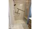 Accessible shower featuring grab bars and a built-in seat at 1103 Charleston Commons Dr, Anderson, IN 46012