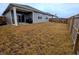 This backyard has a full wooden fence around the yard with a covered patio at 11064 N Sashing Way, Monrovia, IN 46157