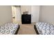 Comfortable bedroom with twin beds, dresser, and neutral walls at 11064 N Sashing Way, Monrovia, IN 46157