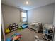 Bright bedroom with a crib, changing table, and play area at 11064 N Sashing Way, Monrovia, IN 46157