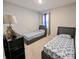 Cozy bedroom featuring two twin beds, a dresser, and natural light at 11064 N Sashing Way, Monrovia, IN 46157