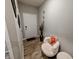 Inviting foyer with wood floors, seating area, and decorative wall accents at 11064 N Sashing Way, Monrovia, IN 46157