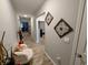 Hallway with wood floors, neutral paint, and decorative wall accents at 11064 N Sashing Way, Monrovia, IN 46157