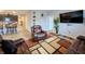 Comfortable living room with leather seating and open flow to the kitchen and other living spaces at 11064 N Sashing Way, Monrovia, IN 46157