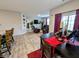Open-concept living and dining area with hardwood floors, modern furnishings, and plenty of natural light at 11064 N Sashing Way, Monrovia, IN 46157