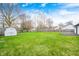 Expansive backyard with lush lawn, shed, privacy fence, and trees at 11363 Kristen Ln, Indianapolis, IN 46235