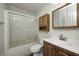 Bathroom featuring a vanity, mirror, shower-tub combination with sliding glass doors and a toilet at 11363 Kristen Ln, Indianapolis, IN 46235