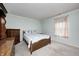 Bedroom featuring a bed, chest of drawers and window offering natural light at 11363 Kristen Ln, Indianapolis, IN 46235