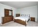 Well furnished bedroom featuring wooden furniture, queen sized bed and carpeted flooring at 11363 Kristen Ln, Indianapolis, IN 46235