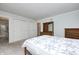 Bedroom with bed and nightstand; closet and bathroom connected via doorways at 11363 Kristen Ln, Indianapolis, IN 46235