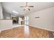 Open living room boasts hardwood floors, fireplace and a view into the kitchen at 11363 Kristen Ln, Indianapolis, IN 46235