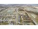 Aerial view of the neighborhood showing the homes, streets, landscaping, and surrounding ponds at 11614 Presidio Dr, Indianapolis, IN 46235