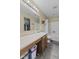 Bathroom featuring a shower-tub combo, vanity, and neutral-toned walls at 11614 Presidio Dr, Indianapolis, IN 46235