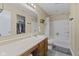 Bathroom featuring a shower-tub combo, vanity, and neutral-toned walls at 11614 Presidio Dr, Indianapolis, IN 46235